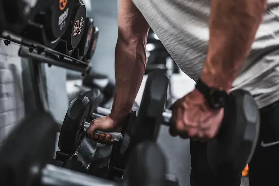 Close-up of hands racking a dumbbell in a home gym